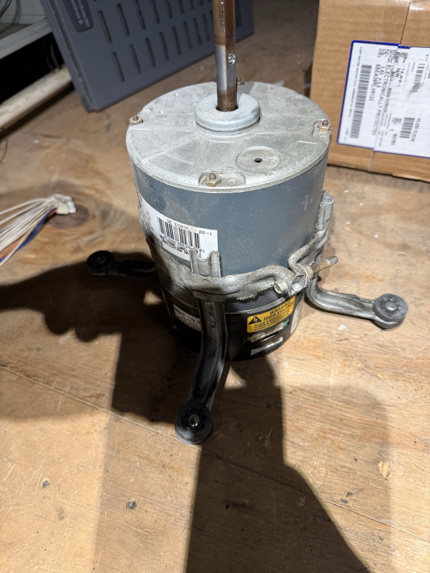 Blower motor removed for replacement during HVAC repair